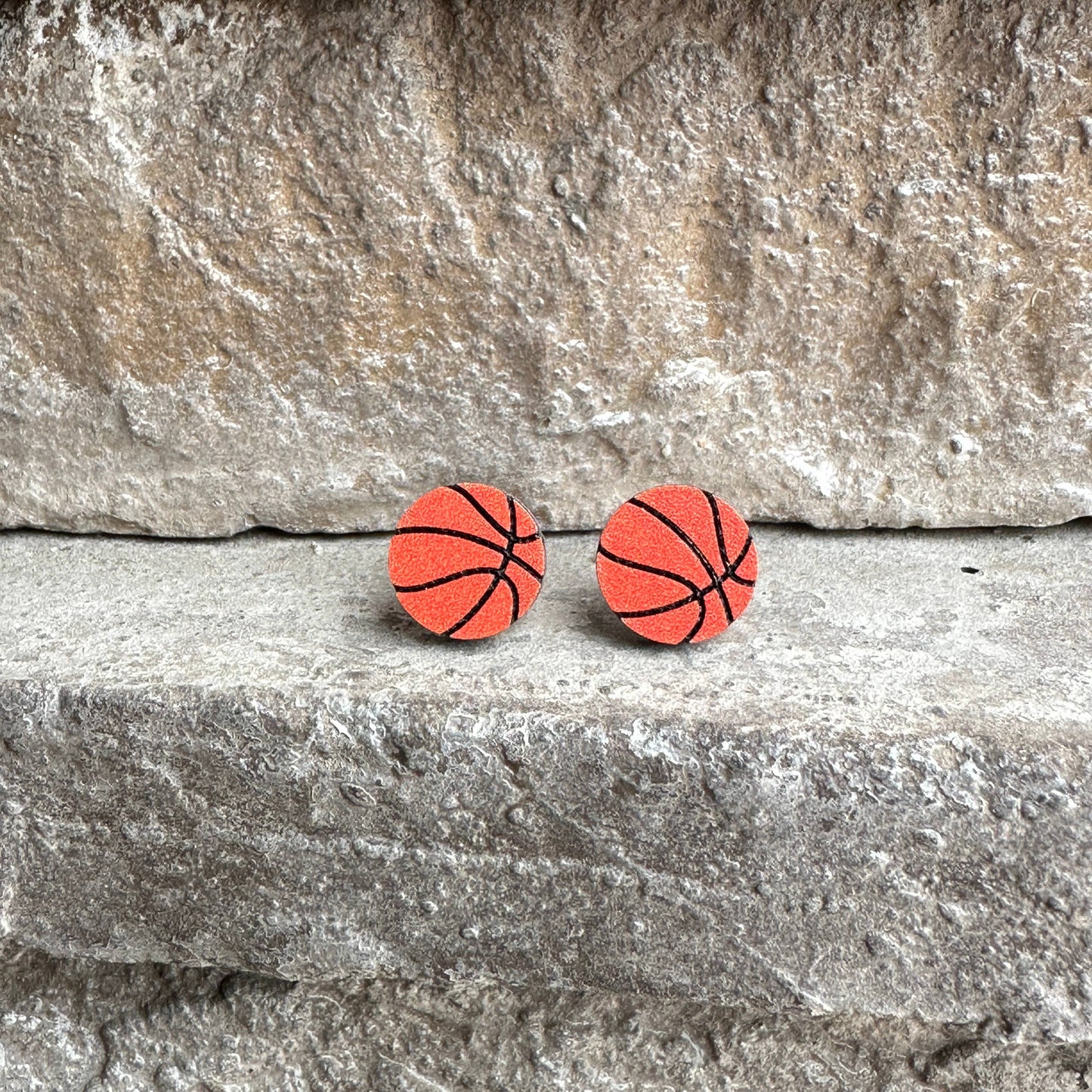 Basketball Round Stud Earrings Stone Background Up Close