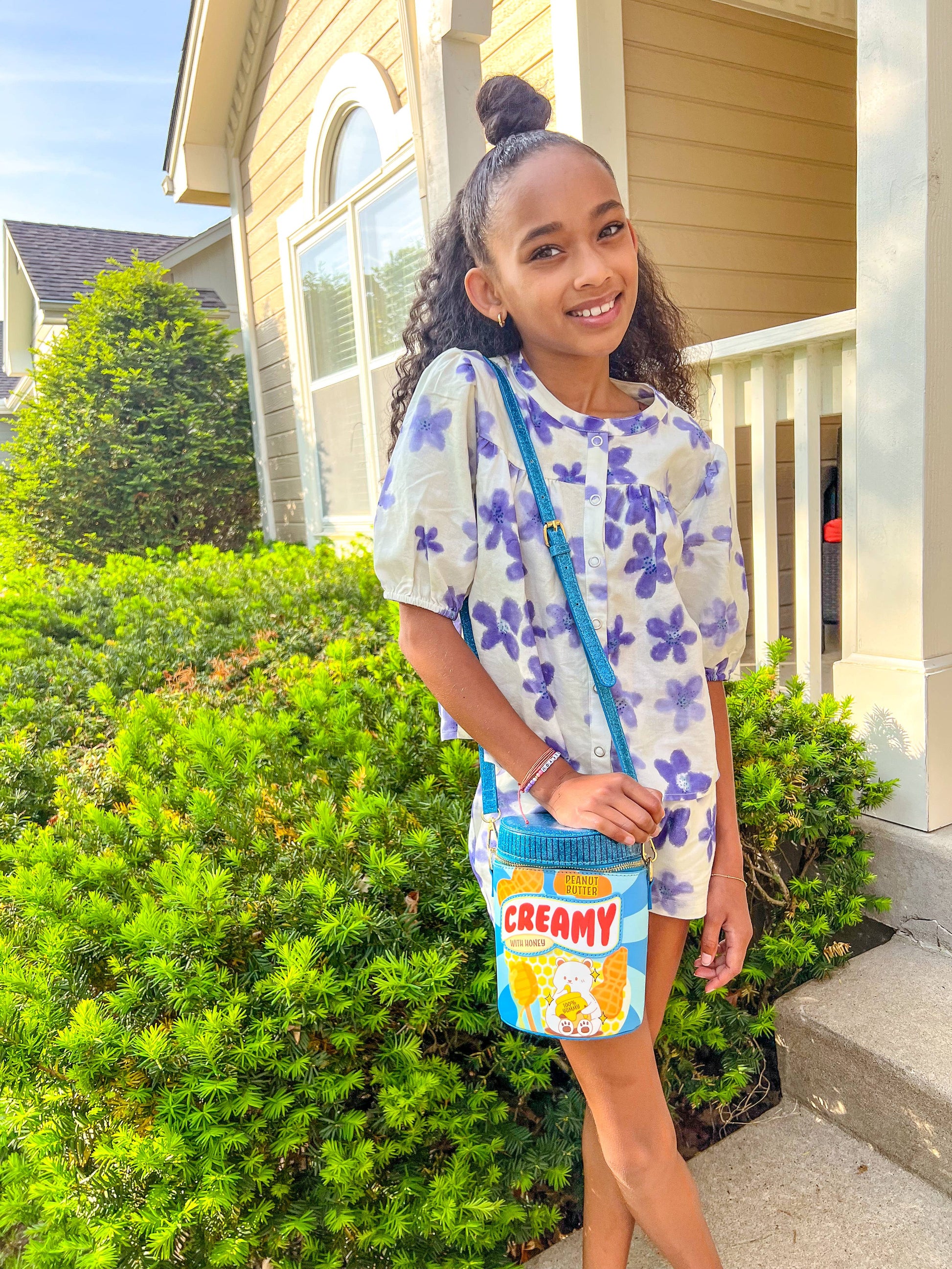 Pre-teen holding the Creamy Peanut Butter Jar Purse